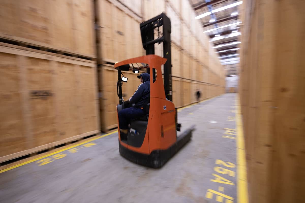 Forklift driver in warehouse