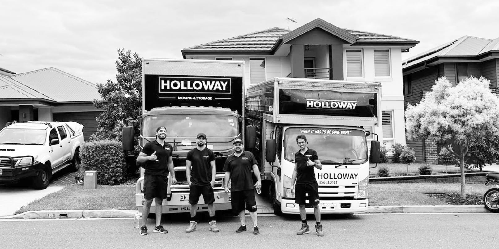 Holloway team in front of a truck