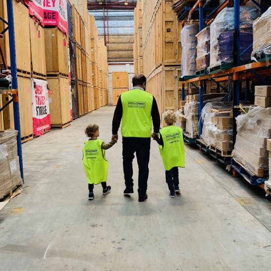 Andy and his sons in the Holloway warehouse