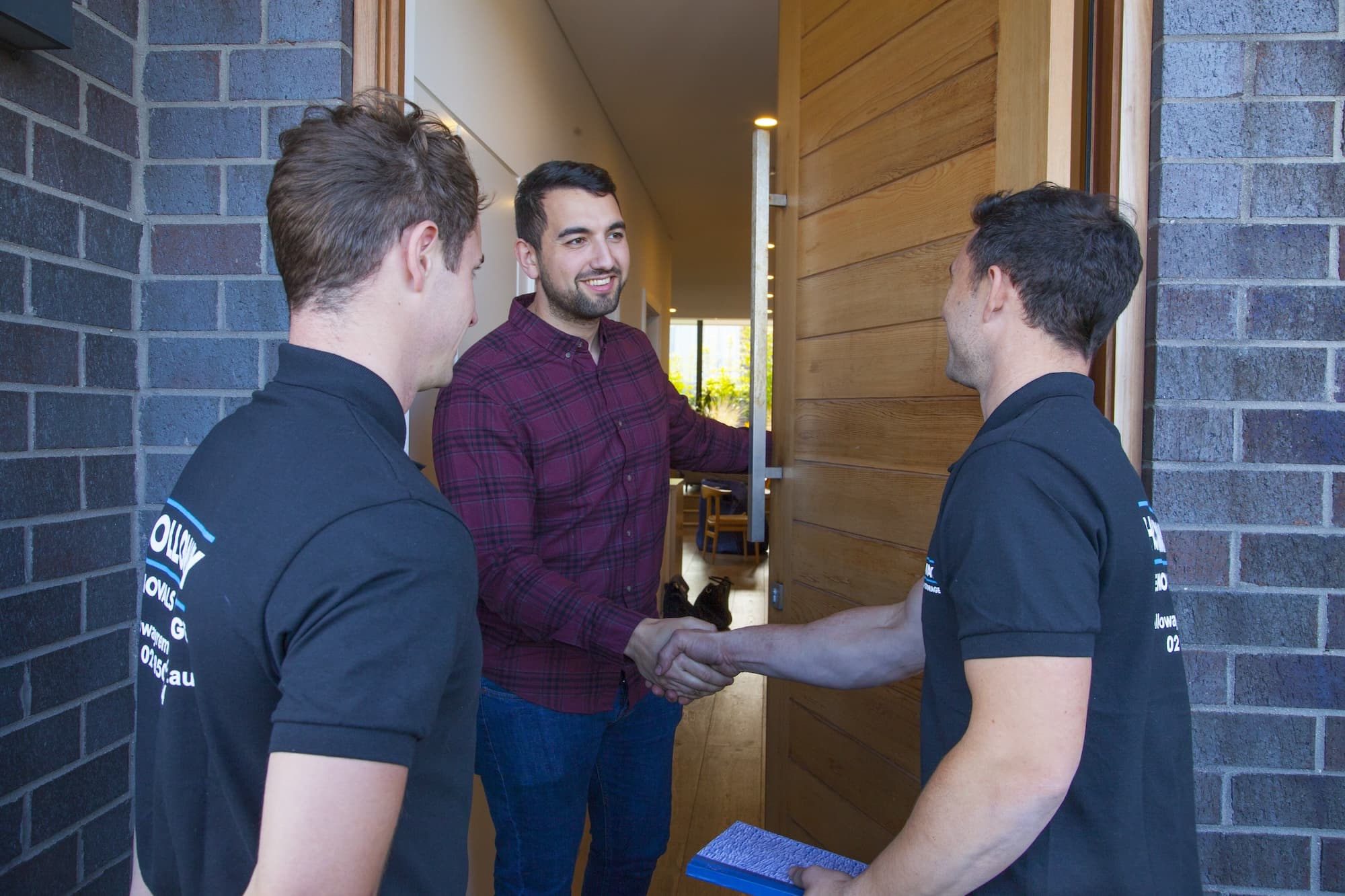 Holloway removalists greeting a customer at the door