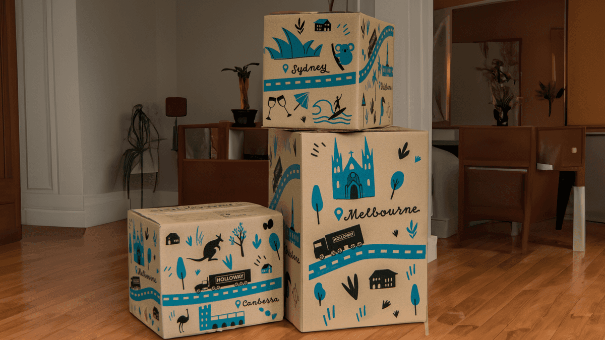 Stacked custom moving boxes with Holloway Removals branding
