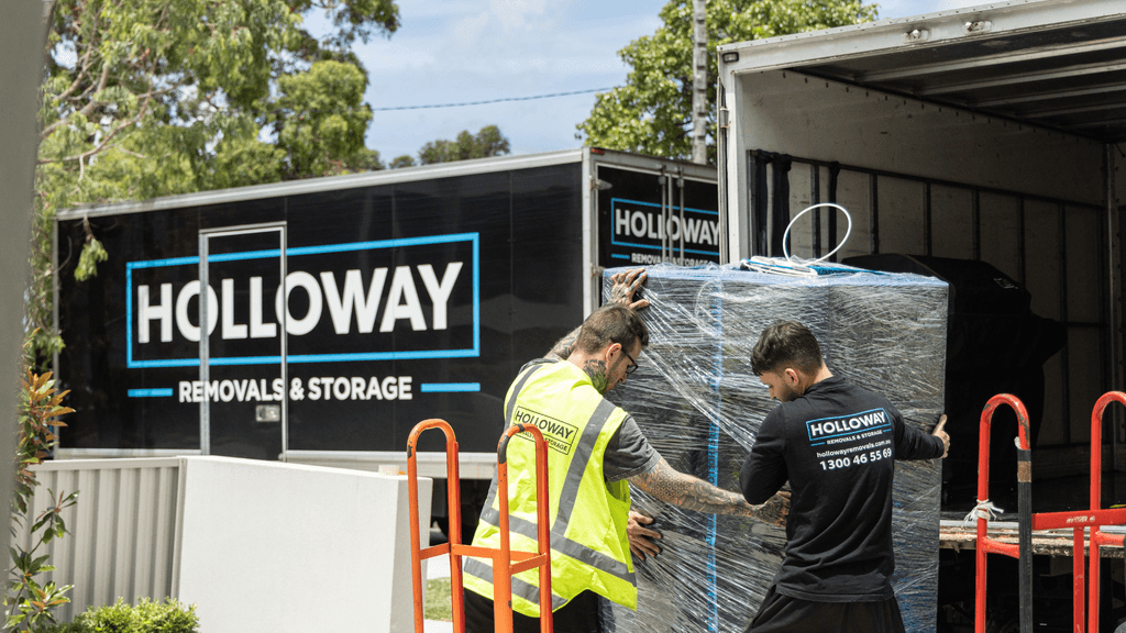 holloway removalists moving wrapped fridge into moving truck