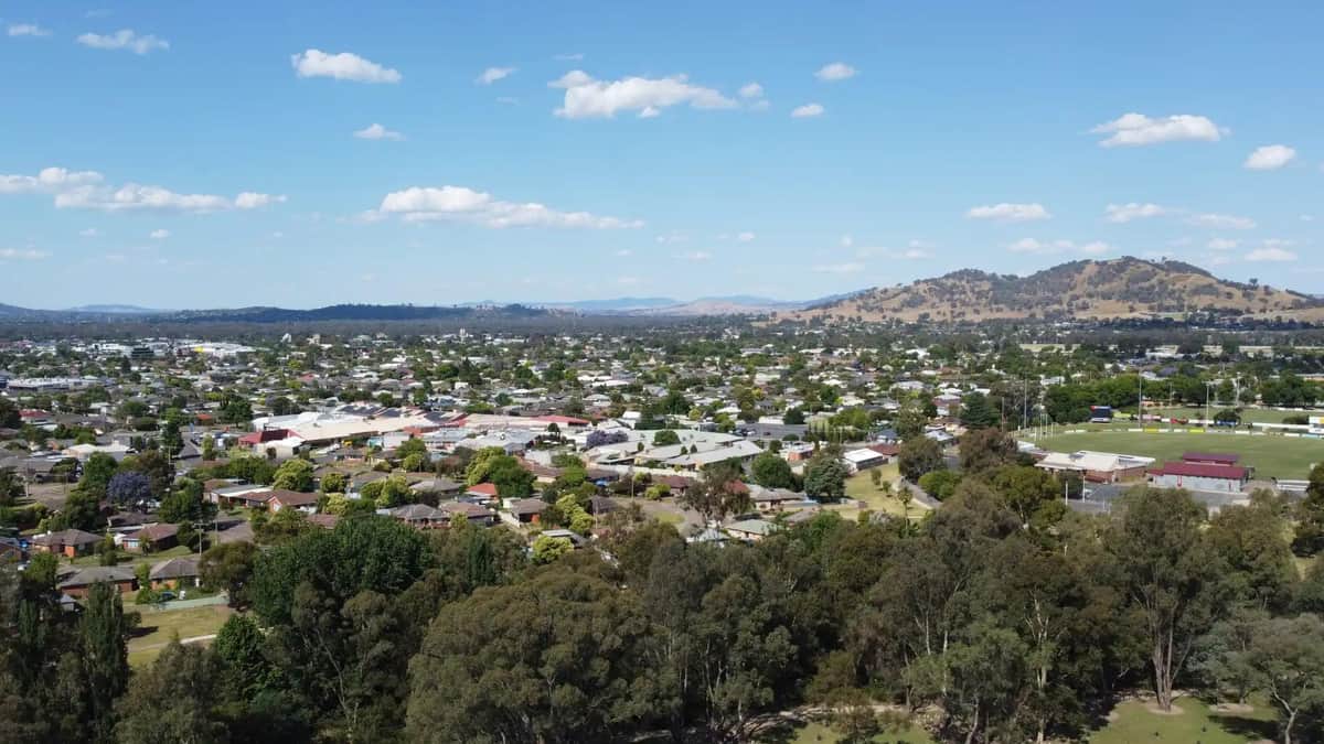 aerial view of a Wodonga town with hills and green spaces in the background