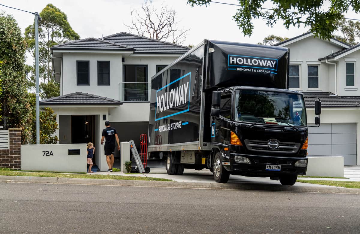 moving truck outside a home, moving with kids