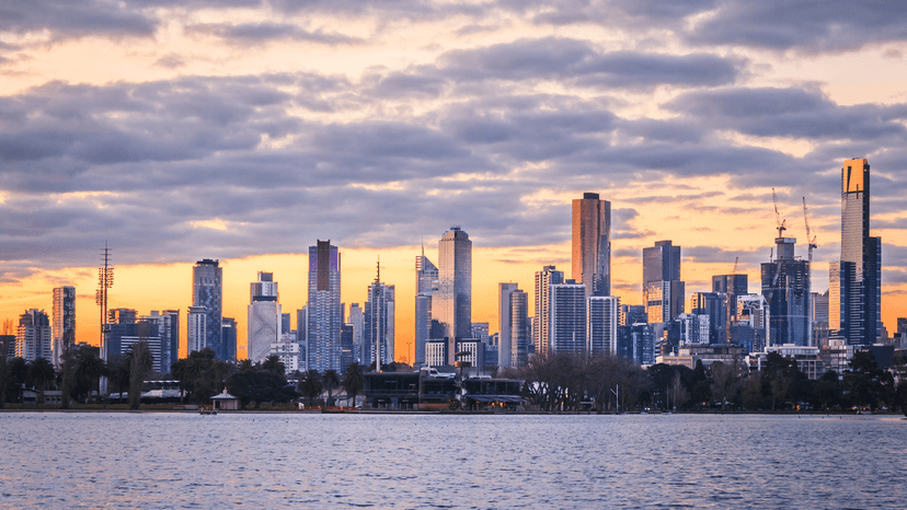 Melbourne skyline at sunset, featuring tall skyscrapers on Albert Park