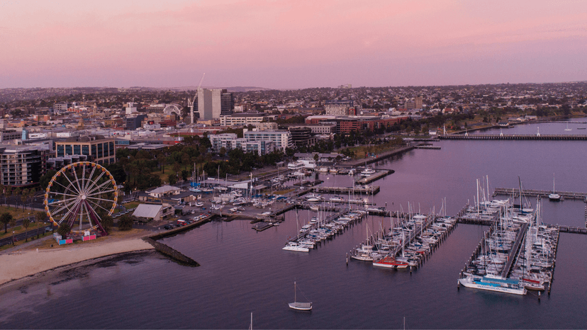 Aerial view of the Geelong waterfront, the Giant Sky Wheel, a yacht-filled marina at sunset