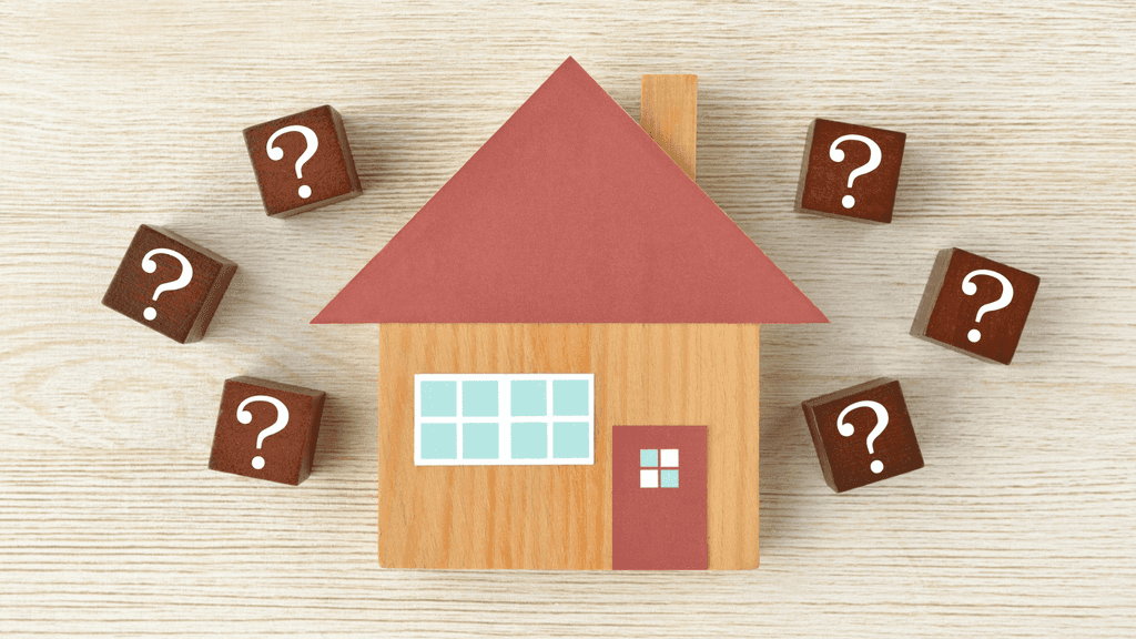 wooden block house surrounded by question mark blocks