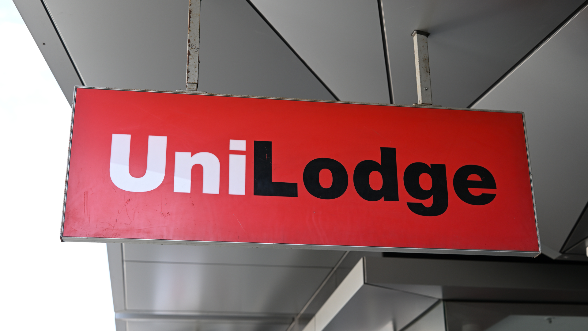 Red hanging "Unilodge" sign in Swinburne University