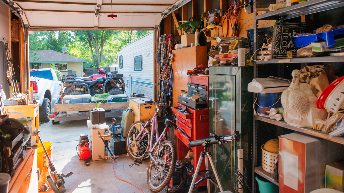 garage full of bikes and tools, what seasonal storage solves
