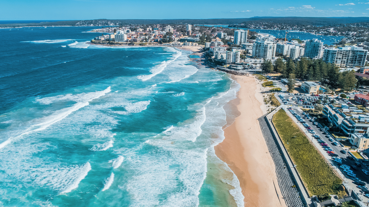 Aerial panoramic view of Cronulla Beach in Sydney, Australia with seaside apartments.