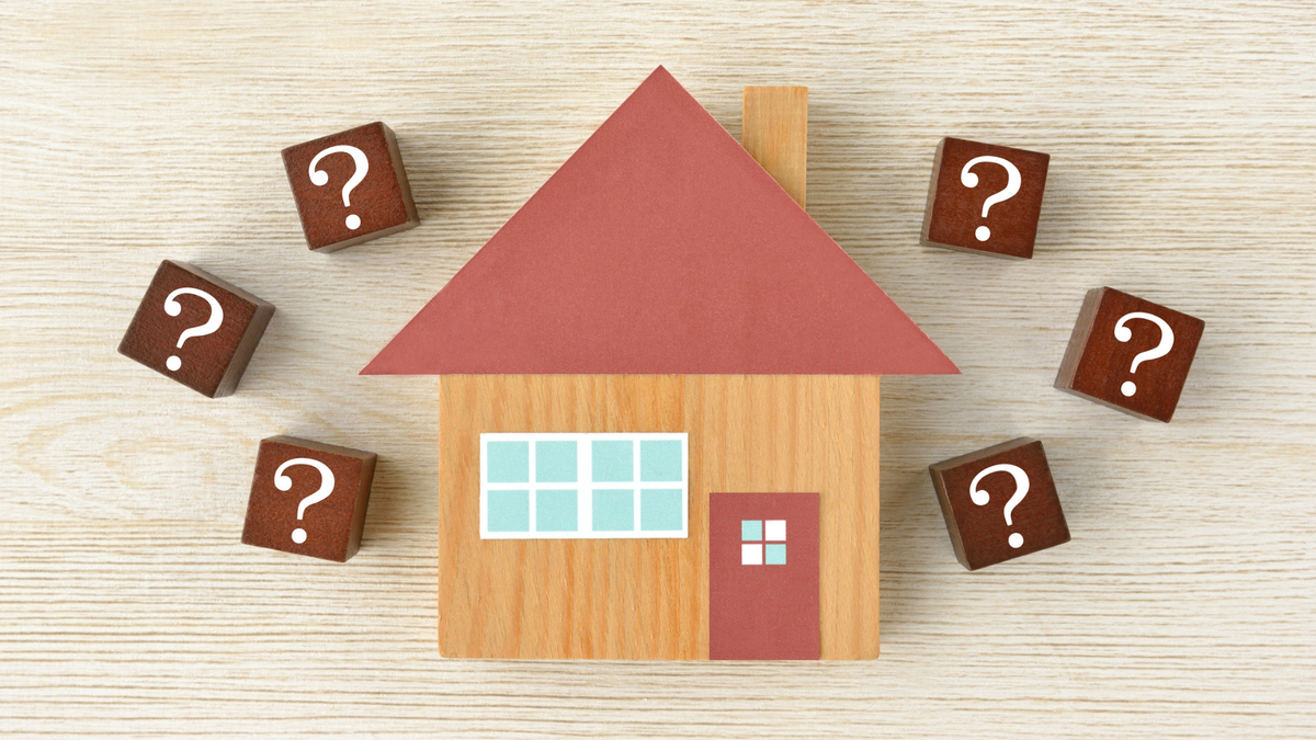 wooden block house surrounded by question mark blocks